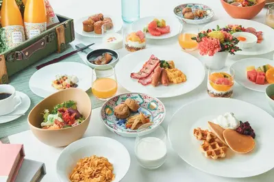 a table full of plates of food and drinks at Shiba Park Hotel in Tokyo