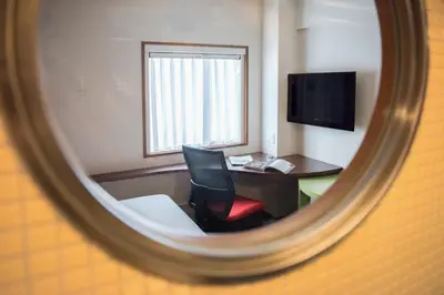 a room with a desk and a chair and a computer at the b akasaka in Tokyo