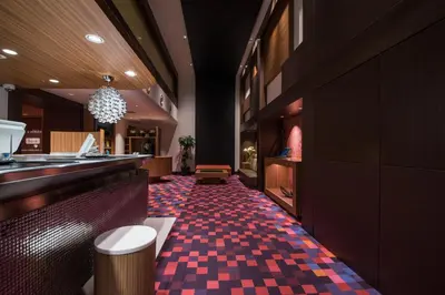 a restaurant with a red and black checkered floor at the b akasaka in Tokyo