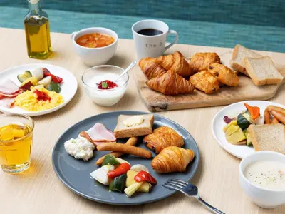 a table with plates of food and a cup of coffee at the b ochanomizu in Tokyo