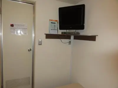 a television sitting on a shelf in a room at Hotel Yanagibashi in Tokyo