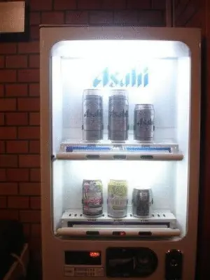 an open refrigerator with cans of soda in it at Hotel Yanagibashi in Tokyo