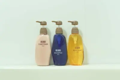 a group of three bottles sitting on a shelf at Meitetsu Inn Hamamatsucho in Tokyo