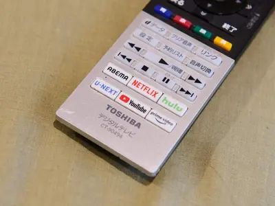 a remote control sitting on top of a table at Tabist Hotel Tetora Ikebukuro in Tokyo