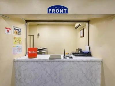 an office with a front desk with a sign at Tabist Hotel Tetora Ikebukuro in Tokyo