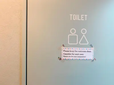 a door with a toilet sign on it at Good Diner Inn Copain in Tokyo