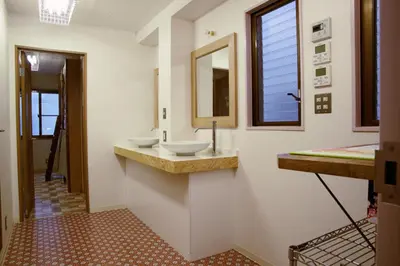 a bathroom with two sinks and a mirror at Good Diner Inn Copain in Tokyo