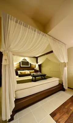 two beds in a bedroom with a canopy at AROMA+ (Adult Only) in Tokyo
