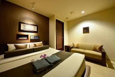 a bedroom with a large bed and a couch at AROMA+ (Adult Only) in Tokyo