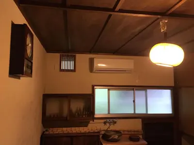 a room with a window and a sink and a light at Kagaribi Guesthouse in Tokyo