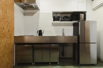 a kitchen with a sink and a refrigerator at DENCHI TOKYO - Private Designer Stay in Asakusa in Tokyo