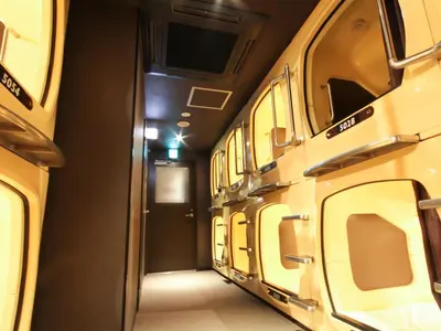 an empty train car with the doors open and a hallway at Gran Custama Ueno in Tokyo