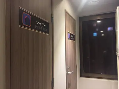 a door in a room with a sign on it at Gran Custama Ueno in Tokyo