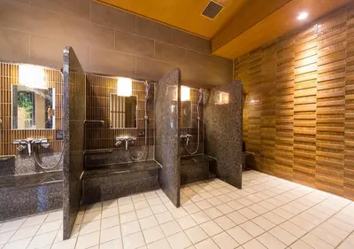 a public bathroom with two stalls with two at Dormy Inn Premium Tokyo Kodenmacho in Tokyo