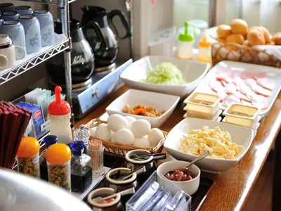 a counter with eggs and other food items on it at Hotel Cerezo in Tokyo