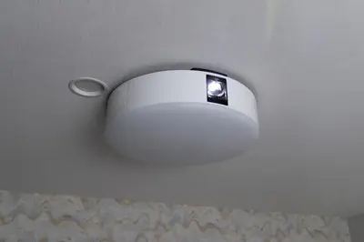 a white light on the ceiling of a room at Hotel Cerezo in Tokyo