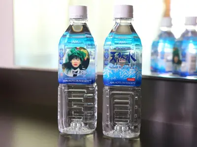 two bottles of water sitting on a table at APA Hotel Ginza Shintomicho Ekimae Kita in Tokyo