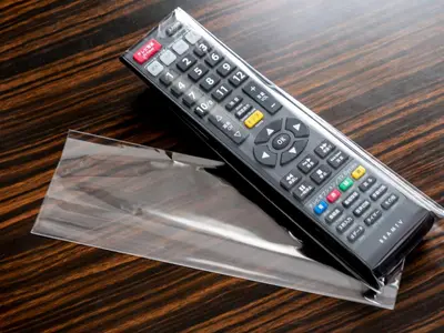a remote control sitting on top of a table at APA Hotel Ginza Shintomicho Ekimae Kita in Tokyo