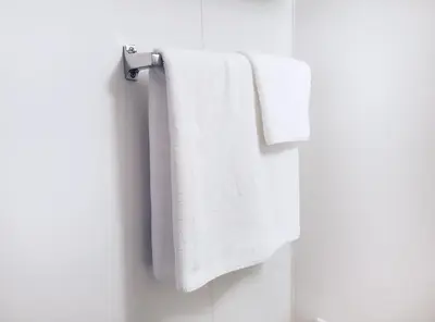 two towels hanging on a towel rack in a bathroom at Hotel Trend Asakusa in Tokyo