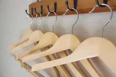 a row of wooden utensils hanging on a rack at Best Hotel in Tokyo