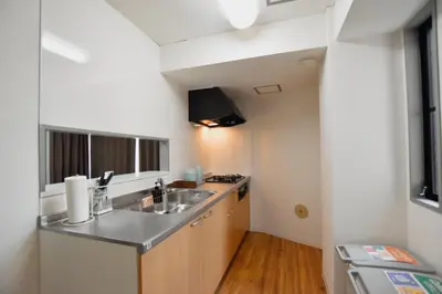 a small kitchen with a sink and a stove at Randor Residence Tokyo Classic in Tokyo