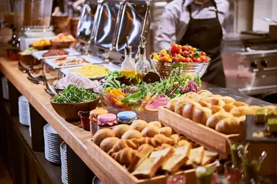 a buffet of food on a table in a kitchen at remm Roppongi in Tokyo