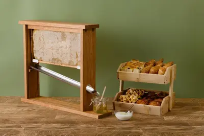 a stand with a shelf of bread and a box of pastries at remm Roppongi in Tokyo