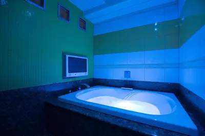 a bathroom with a tub with a tv in it at HOTEL AN Shinjuku Kabukicho (Adult Only) in Tokyo