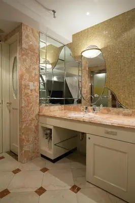 a bathroom with a sink and a large mirror at HOTEL AN Shinjuku Kabukicho (Adult Only) in Tokyo