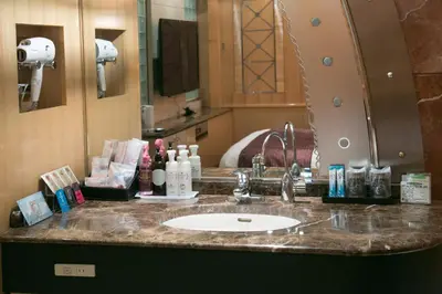 a bathroom counter with a sink and a mirror at HOTEL AN Shinjuku Kabukicho (Adult Only) in Tokyo