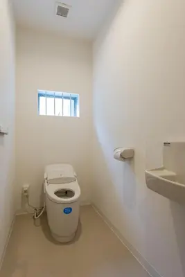 a white bathroom with a toilet and a sink at Tokyo Guest House Itabashi-juku in Tokyo