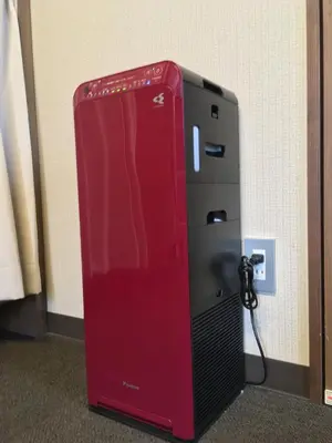a red refrigerator sitting next to a wall at Tokyo Guest House Itabashi-juku in Tokyo
