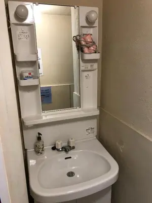 a bathroom with a sink and a mirror at Tokyo Guest House Itabashi-juku in Tokyo