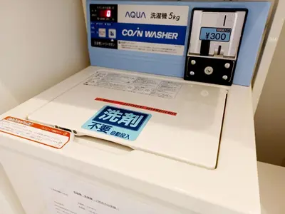 a display of a laptop on a white table with a box at Akasaka Urban Hotel in Tokyo