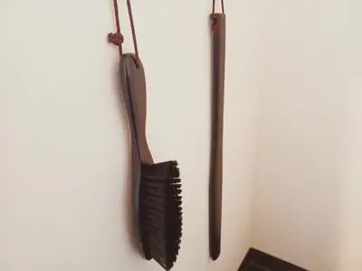 a black brush is hanging on a wall at Akasaka Urban Hotel in Tokyo