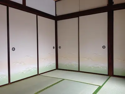 a room with four glass doors with flowers on it at Keys House in Tokyo