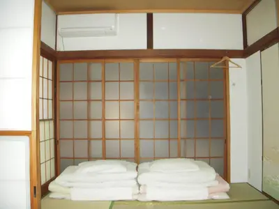 a room with two bunk beds in it at Keys House in Tokyo