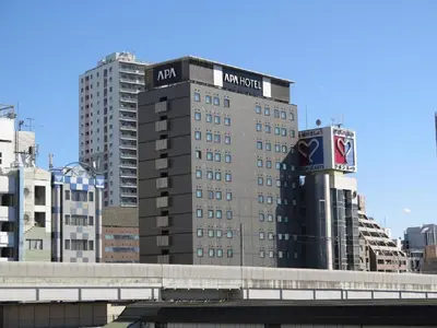 a building with aania sign on the top of it at APA Hotel TKP Nippori Ekimae in Tokyo