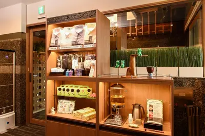 a display case in a store with a coffee maker at Anshin oyado Tokyo Woman Ginza Shiodome in Tokyo
