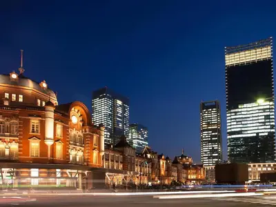 a building with a city skyline in the background at Anshin oyado Tokyo Woman Ginza Shiodome in Tokyo