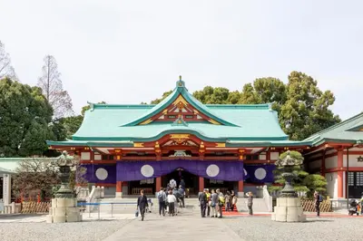 a temple with people walking in front of it at Akasaka-no Sato (Female Only) in Tokyo