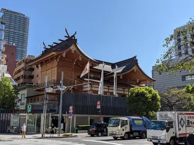a building with an asian roof on a city street at City Pension Zem in Tokyo