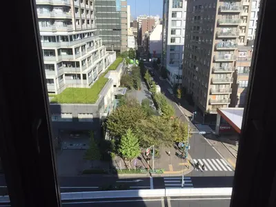 a view of a city street with tall buildings at City Pension Zem in Tokyo