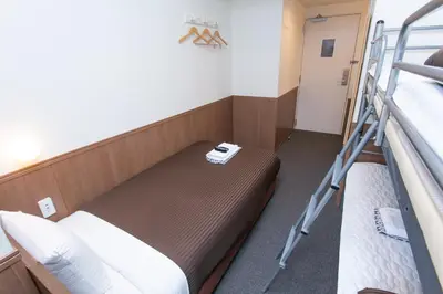 a bunk bed in a room with two bunk beds at Oak Hotel Edo in Tokyo