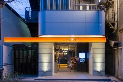 a store front with an orange sign on a building at Hotel COREST (Adult Only) in Tokyo