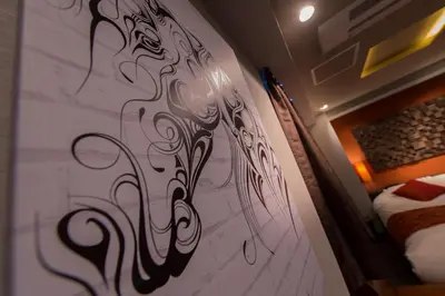 a wall with a design on it in a bedroom at Hotel COREST (Adult Only) in Tokyo