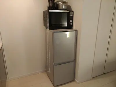 a microwave sitting on top of a refrigerator at Hotel Axas Nihonbashi in Tokyo