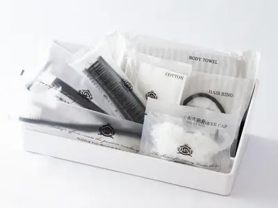 a white box filled with different types of toothbrushes at APA Hotel Iidabashi Ekimae in Tokyo