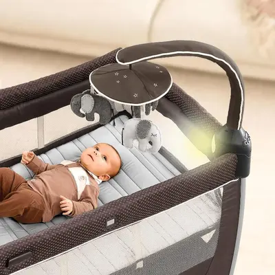 a baby laying in a crib with stuffed animals at Luxury New House in Tokyo