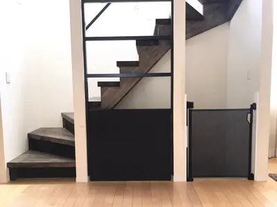a door leading up to a stairwell with a black entry door at Luxury New House in Tokyo